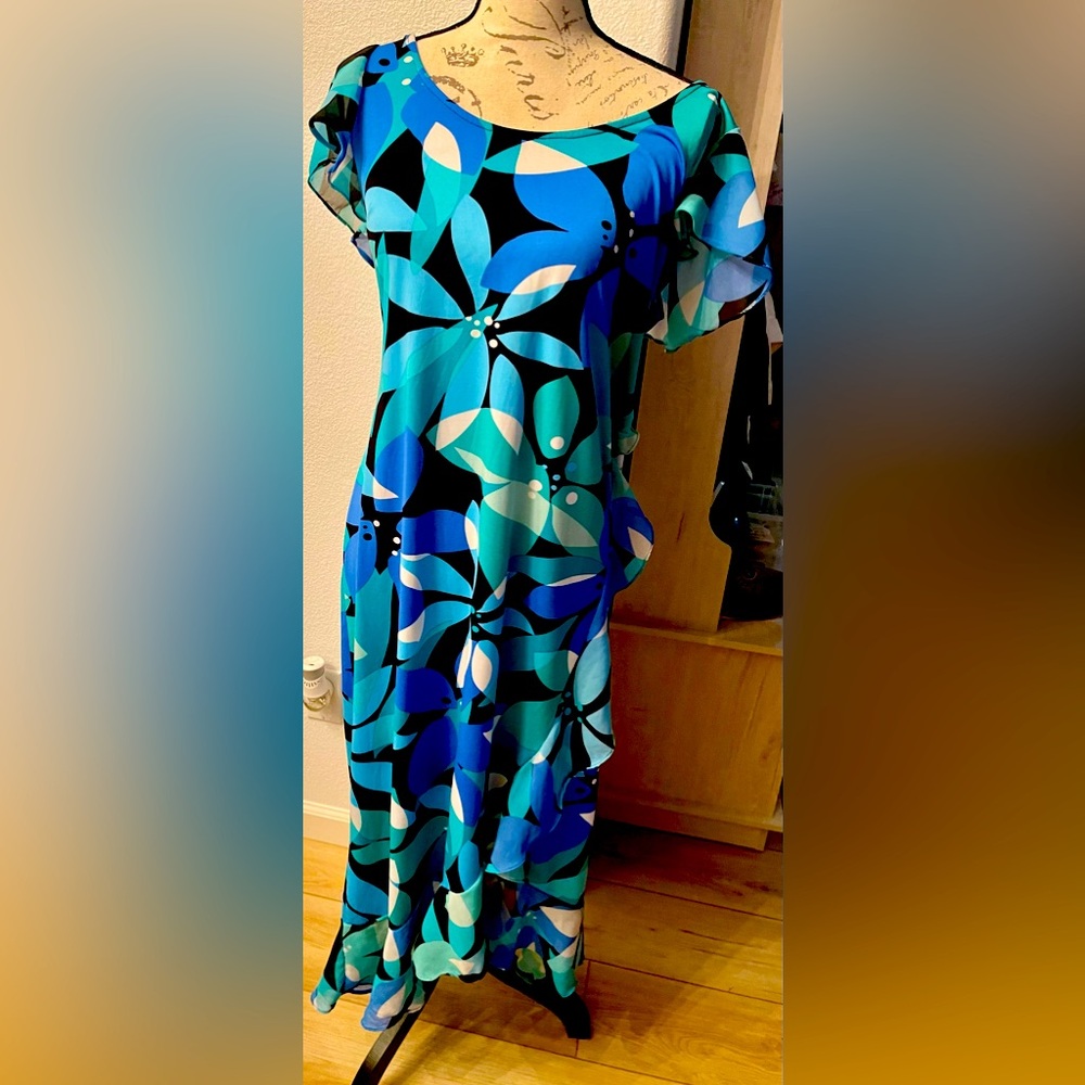 Avenue dress worn once. Size 14/16. Asymmetrical ruffles hem.